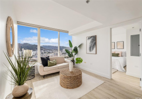 High floor with sweeping mountain/city views.